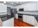 Bright kitchen featuring stainless steel appliances, white cabinets, and granite countertops at 1648 Secessionville Rd, Charleston, SC 29412