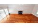 Open-concept living room featuring hardwood floors, fireplace, and lots of natural light at 1648 Secessionville Rd, Charleston, SC 29412