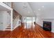 Spacious living room with vaulted ceilings, a fireplace, and hardwood floors, perfect for entertaining guests at 1648 Secessionville Rd, Charleston, SC 29412