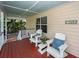 Cozy porch with comfortable seating, featuring stylish pillows and a charming neighborhood view at 1648 Secessionville Rd, Charleston, SC 29412