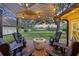 Scenic backyard deck with a fire pit, chairs, and a shady canopy, perfect for enjoying outdoor living and tranquil scenery at 1673 Mcclain St, Charleston, SC 29407