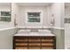 Bathroom featuring a double vanity with square sinks, and tiled shower at 1673 Mcclain St, Charleston, SC 29407