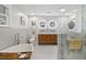 A modern bathroom features a soaking tub, stylish fixtures, and a glass-enclosed shower at 1673 Mcclain St, Charleston, SC 29407