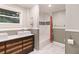 Modern bathroom featuring a double sink vanity, and tiled shower at 1673 Mcclain St, Charleston, SC 29407