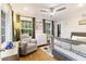 Cozy Bedroom featuring a chair, crib, and a window with natural light at 1673 Mcclain St, Charleston, SC 29407