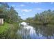 Picturesque canal view with lush greenery, perfect for relaxation and nature appreciation at 1673 Mcclain St, Charleston, SC 29407