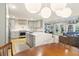 Open concept kitchen with modern appliances, a large island, and seamless flow to the living area at 1673 Mcclain St, Charleston, SC 29407
