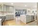 Bright, open kitchen featuring a large island with quartz countertops and stainless steel appliances at 1673 Mcclain St, Charleston, SC 29407