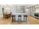 Modern kitchen with a large island, seating, stainless steel appliances, and hardwood floors at 1673 Mcclain St, Charleston, SC 29407