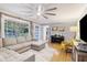 An inviting living room features a large window, plush sectional, and comfortable seating at 1673 Mcclain St, Charleston, SC 29407