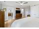 Comfortable bedroom with hardwood floors, a ceiling fan, and access to an ensuite bathroom at 1673 Mcclain St, Charleston, SC 29407