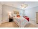 Well-lit bedroom with a cozy bed, ceiling fan, shuttered windows, and charming decor at 1822 Grovehurst Dr, Charleston, SC 29414