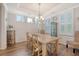 Elegant dining room featuring hardwood floors and stylish chandelier at 1822 Grovehurst Dr, Charleston, SC 29414