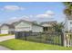 Home exterior, showing garage, fenced yard, and landscaping at 1822 Grovehurst Dr, Charleston, SC 29414