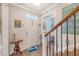 Welcoming foyer with a staircase and hardwood floors, plus stylish decor at 1822 Grovehurst Dr, Charleston, SC 29414