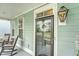 Charming porch with rocking chairs, decorative wreath, and welcoming ambiance at 1822 Grovehurst Dr, Charleston, SC 29414