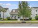 Charming home with a covered porch, manicured landscaping, and mature trees at 1822 Grovehurst Dr, Charleston, SC 29414