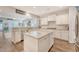 Spacious kitchen with stainless appliances, granite island, breakfast bar and wood floors at 1822 Grovehurst Dr, Charleston, SC 29414