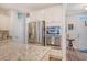Kitchen with stainless steel appliances, granite countertops and view to front entry at 1822 Grovehurst Dr, Charleston, SC 29414