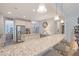 Large kitchen with a breakfast bar, granite countertops and stainless steel appliances at 1822 Grovehurst Dr, Charleston, SC 29414