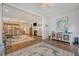 Spacious living area with seamless transition to the dining and kitchen, hardwood floors and a fireplace at 1822 Grovehurst Dr, Charleston, SC 29414