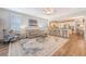 Open-concept floor plan with kitchen, living room, wood floors, ceiling fan and lots of light at 1822 Grovehurst Dr, Charleston, SC 29414