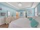 Tranquil main bedroom with hardwood floors and elegant white furniture at 1822 Grovehurst Dr, Charleston, SC 29414