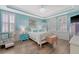 Serene main bedroom with tray ceilings, hardwood floors, and ample natural light at 1822 Grovehurst Dr, Charleston, SC 29414