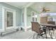 Charming screened porch with outdoor seating, a ceiling fan, and view of the backyard at 1822 Grovehurst Dr, Charleston, SC 29414
