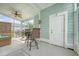 Cozy screened porch featuring stylish outdoor seating and a ceiling fan at 1822 Grovehurst Dr, Charleston, SC 29414