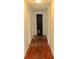 Hallway with wood floors leading to a bathroom at 1871 Grimball Rd, Charleston, SC 29412