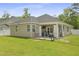 Well-maintained home exterior features a covered patio, fenced yard, and manicured lawn at 201-B Mcmakin Dr, Summerville, SC 29483