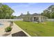 Sprawling backyard with well-manicured lawn, established trees, patio, and additional seating at 201-B Mcmakin Dr, Summerville, SC 29483