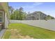 A spacious backyard with a white privacy fence surrounds this property, offering a secure outdoor space at 201-B Mcmakin Dr, Summerville, SC 29483