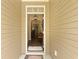Bright and welcoming entryway with stylish lighting fixtures and a glimpse into the home's interior at 201-B Mcmakin Dr, Summerville, SC 29483
