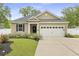 Inviting home exterior with well-manicured lawn, charming curb appeal, and attached garage at 201-B Mcmakin Dr, Summerville, SC 29483