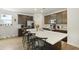 Modern kitchen with stainless steel appliances and a large center island with bar stool seating at 201-B Mcmakin Dr, Summerville, SC 29483