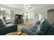 Comfortable living room features large sofa, stylish decor, and natural light from bright windows at 201-B Mcmakin Dr, Summerville, SC 29483