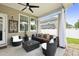 Inviting covered patio with comfortable seating, overhead fan, and serene view of the backyard at 201-B Mcmakin Dr, Summerville, SC 29483