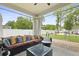 Cozy covered patio featuring comfortable seating, a stylish coffee table, and serene backyard views at 201-B Mcmakin Dr, Summerville, SC 29483
