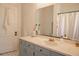 Bathroom with patterned floors, vanity, and shower at 203 Weiters St, Walterboro, SC 29488