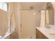 Modern bathroom featuring a walk-in shower with white tile, marble countertop, and wooden cabinets at 203 Weiters St, Walterboro, SC 29488