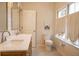 Bright bathroom with a double vanity, large mirrors, and windows at 203 Weiters St, Walterboro, SC 29488