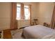 Cozy bedroom features natural light, neutral colors, and a comfortable bed at 203 Weiters St, Walterboro, SC 29488