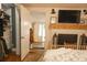 Cozy bedroom featuring a fireplace, TV, closet and a view to living room at 203 Weiters St, Walterboro, SC 29488