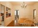 Inviting dining room featuring wood floors, a chandelier, and an open archway at 203 Weiters St, Walterboro, SC 29488