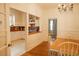 Open dining room with views into a kitchen area and a bedroom at 203 Weiters St, Walterboro, SC 29488