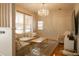 Bright living room featuring hardwood floors, a crystal chandelier, and plenty of natural light at 203 Weiters St, Walterboro, SC 29488