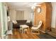 Cozy living room features a brick fireplace, modern ceiling fan, and sleek gray couch at 203 Weiters St, Walterboro, SC 29488