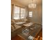 Bright living room features a comfortable couch, decorative rug, and a beautiful chandelier at 203 Weiters St, Walterboro, SC 29488